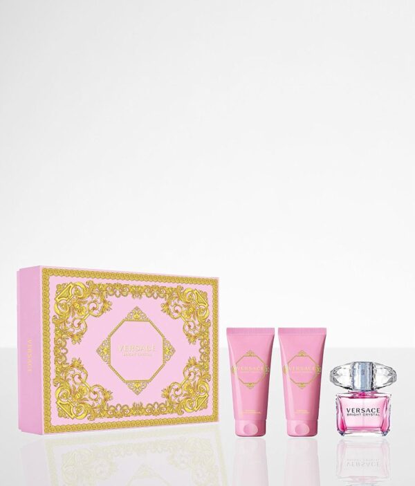 A pink box with two bottles of lotion and a tube of cream.