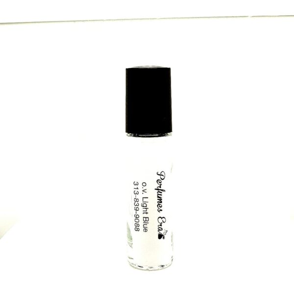 A bottle of white liquid with black cap.