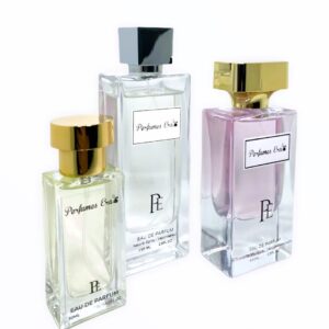 Three different bottles of perfume on a white background