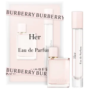 A set of three perfumes in pink packaging.