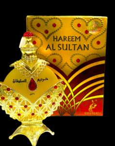 Gold perfume bottle with red jewels.
