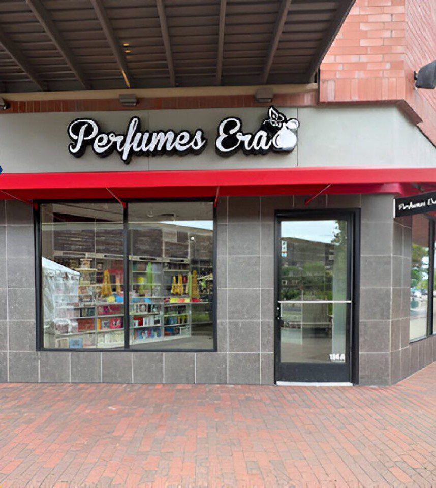 Perfumes Era storefront with red awning.